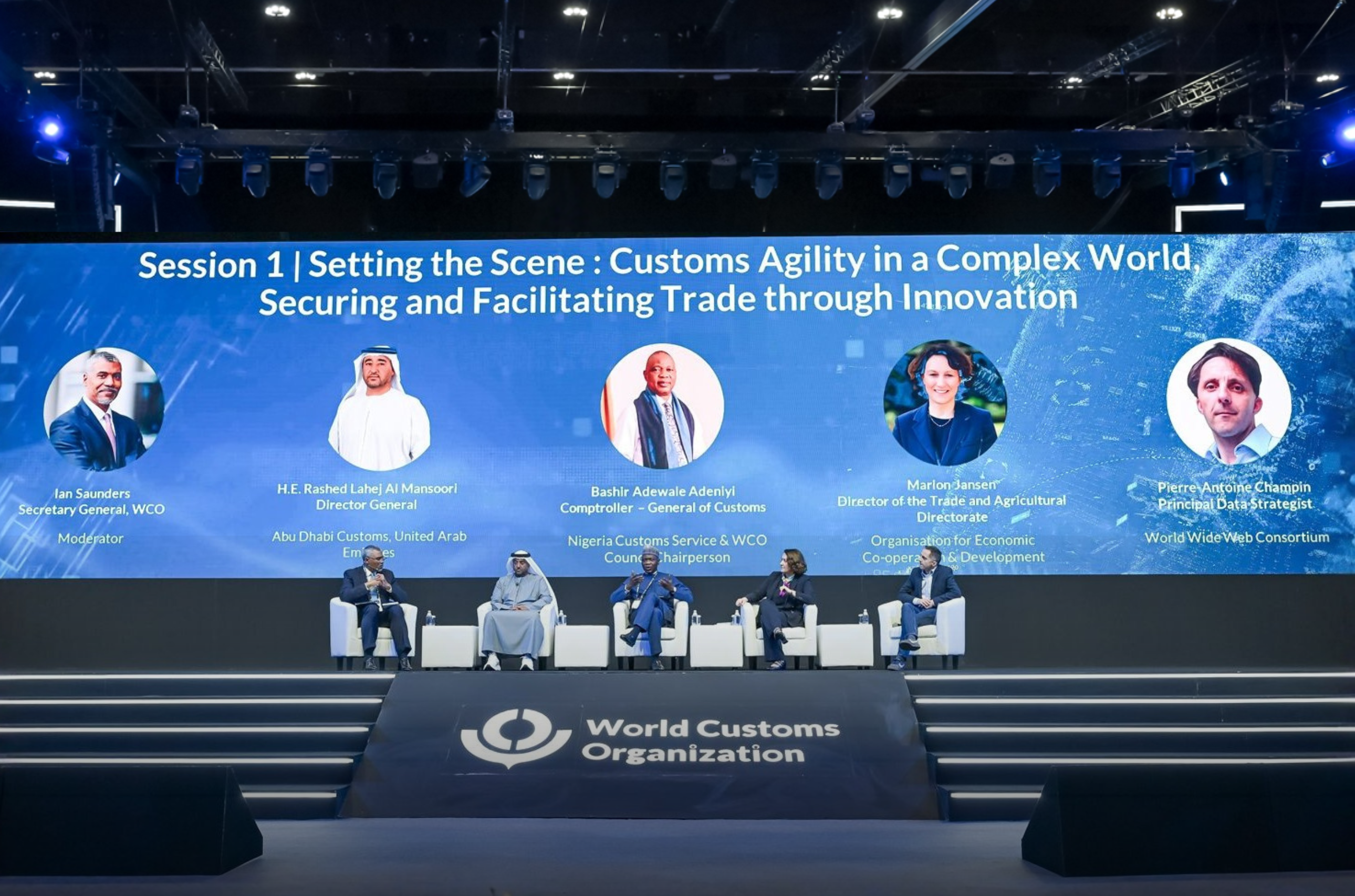 Opening conference with Ian Saunders, Secretary General of WCO; Rashed Al Mansoori, Director General of Abu Dabi Customs; Bashir Adewale Adeniyi, General of Customs of Nigeria Customs Service and WCO Council Chairperson; Marion Jansen, Director of the Trade and Agricultural Directorate at the Organisation for Economic Co-operation and Development (OECD); and Pierre-Antoine Champin, Principal Data Strategist at the World Wide Web Consortium.